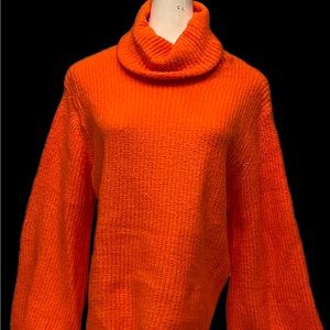 Fashion Apparel. Very soft and comfortable sweater in neon orange color.